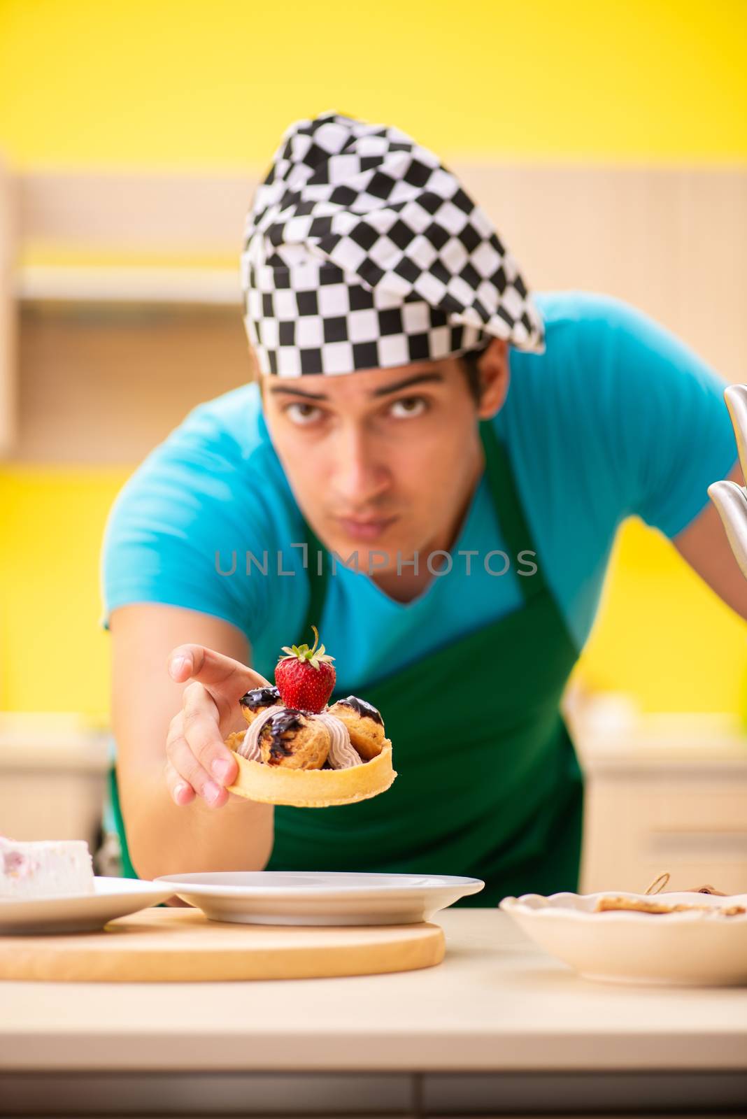 Man cook preparing cake in kitchen at home