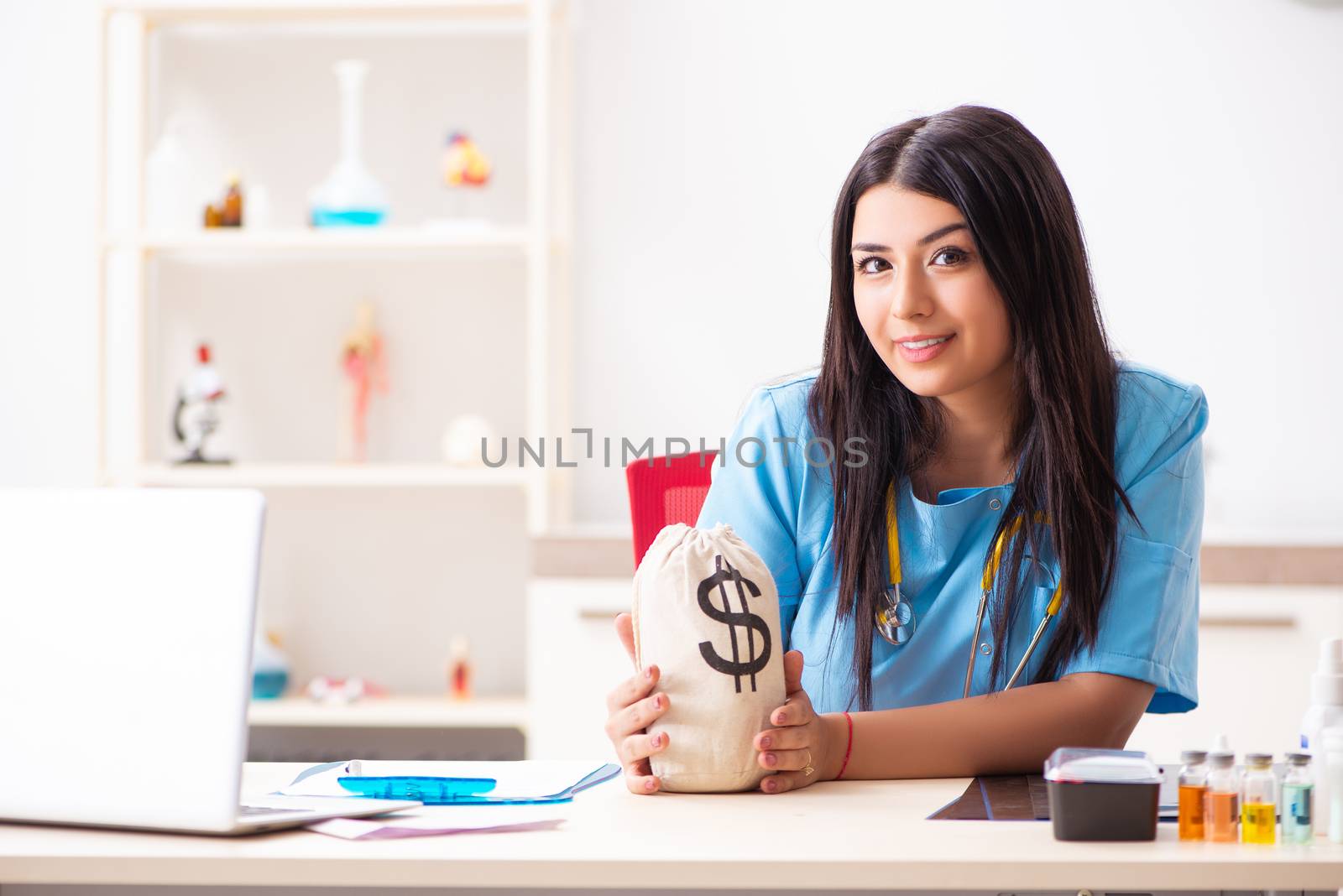 Young beautiful female doctor working in the clinic 