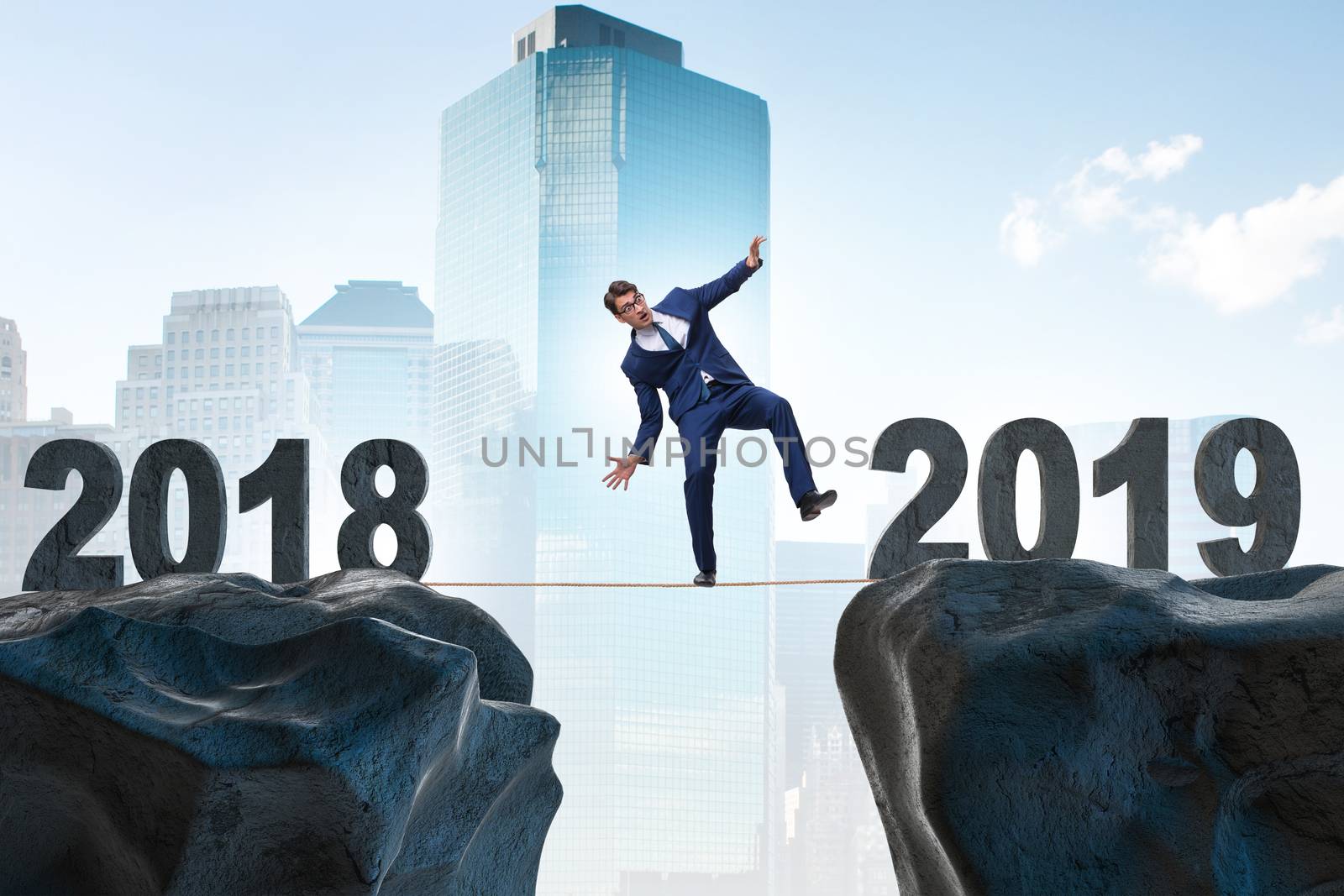 Businessman balancing between 2018 and 2018
