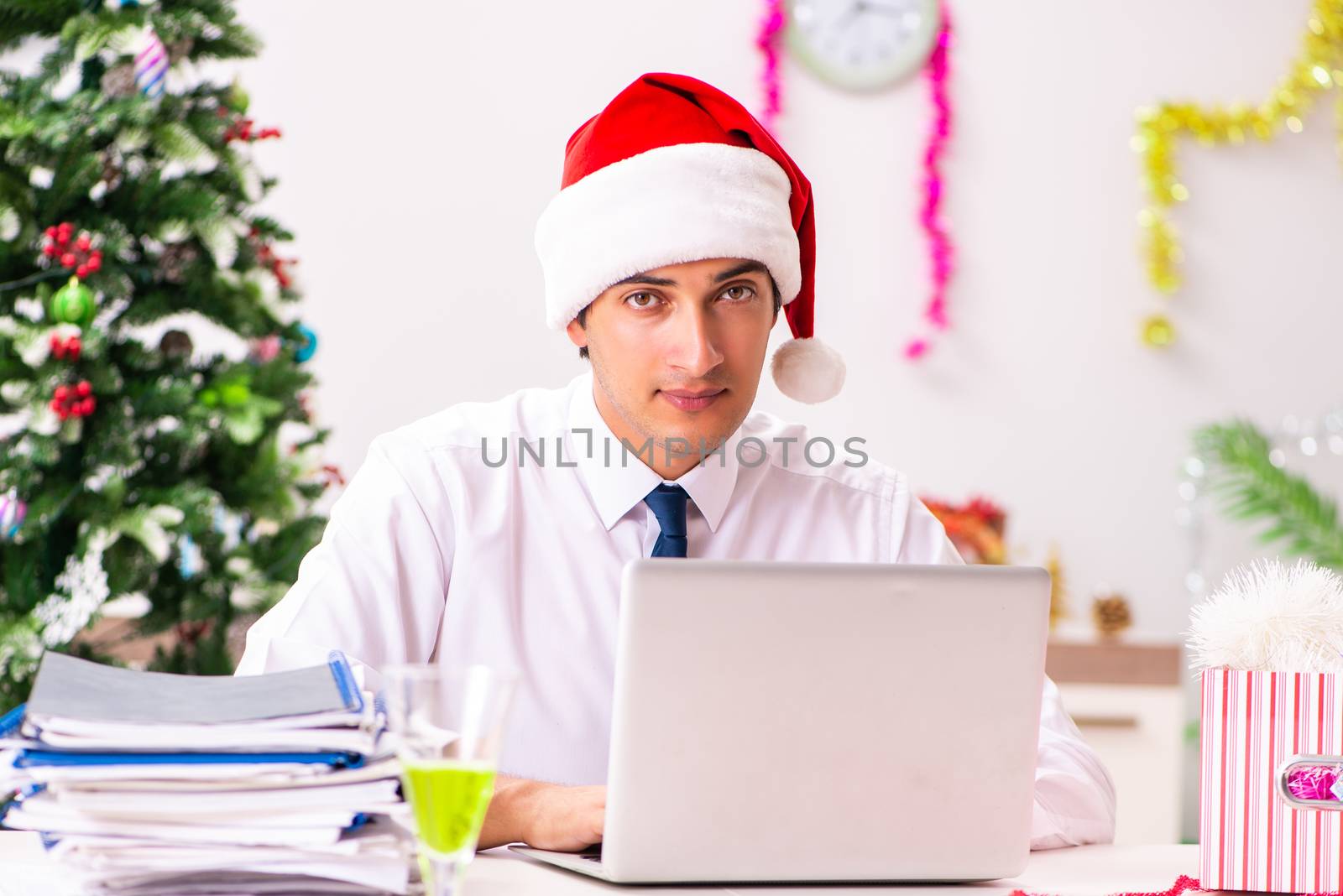 Employee businessman celebrating christmas in office