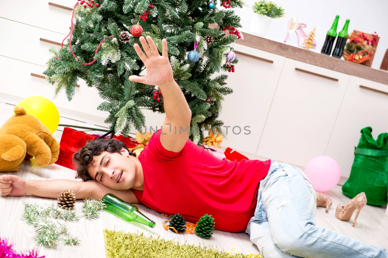 Young man drunk at home after christmas party