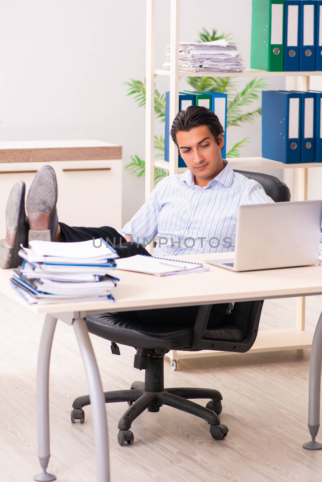 Young employee sitting at the office 