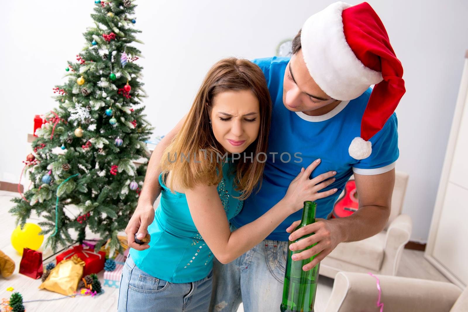 Young family celebrating christmas at home