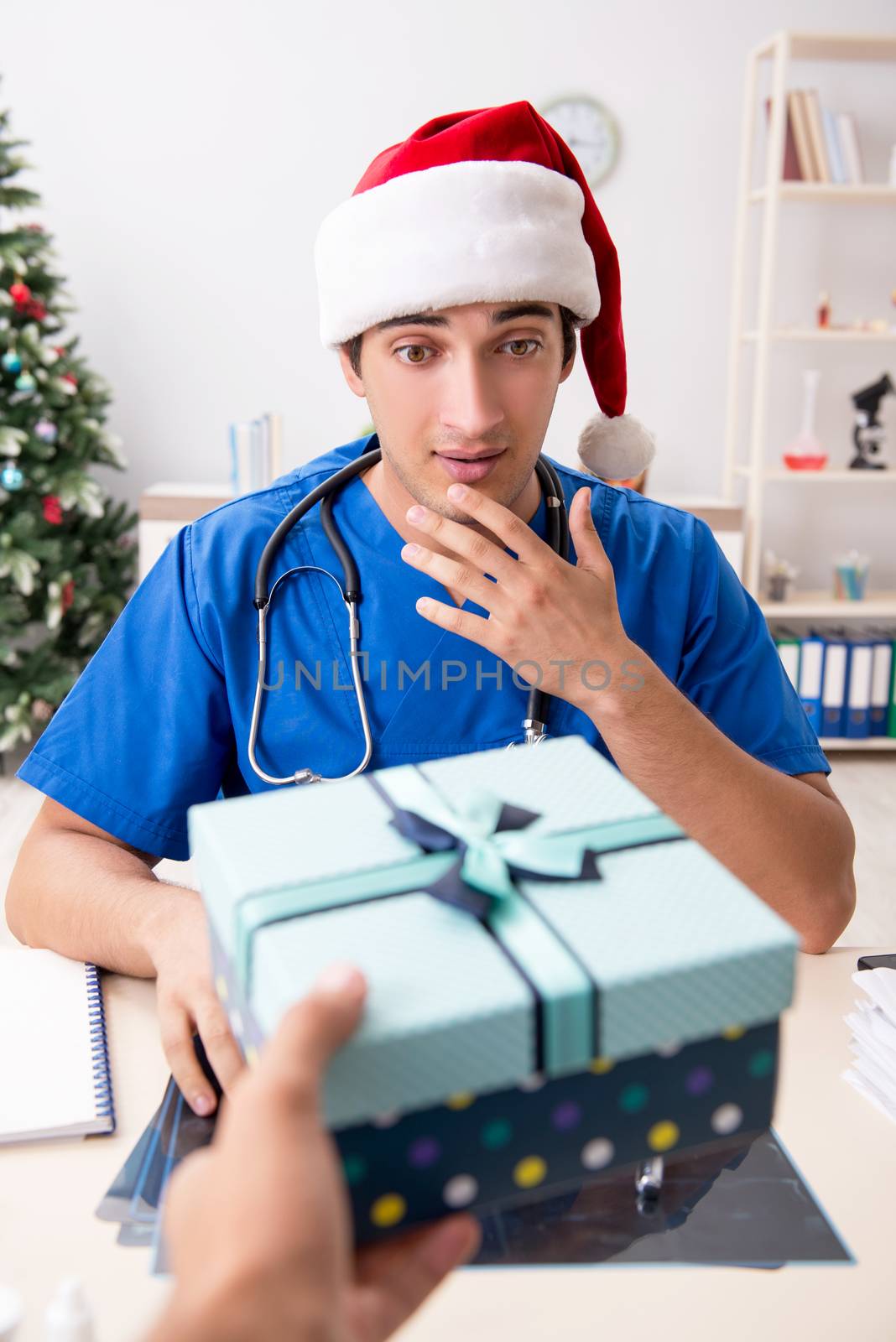 Doctor with gift box in the hospital