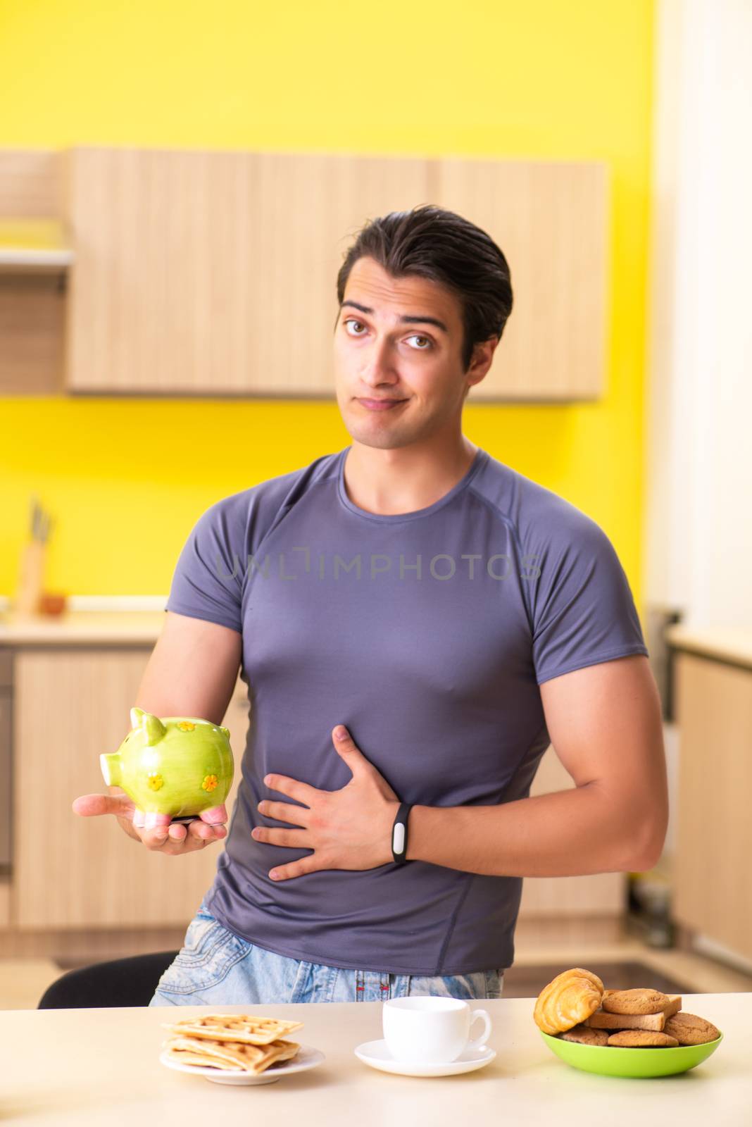 Young man in unhealthy food concept