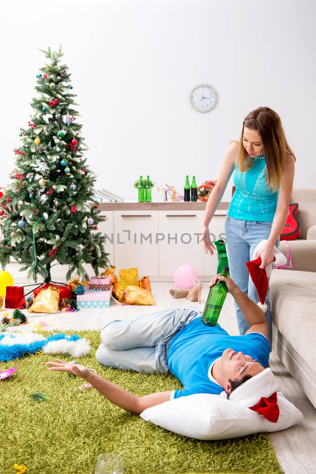 Young family celebrating christmas at home by Elnur