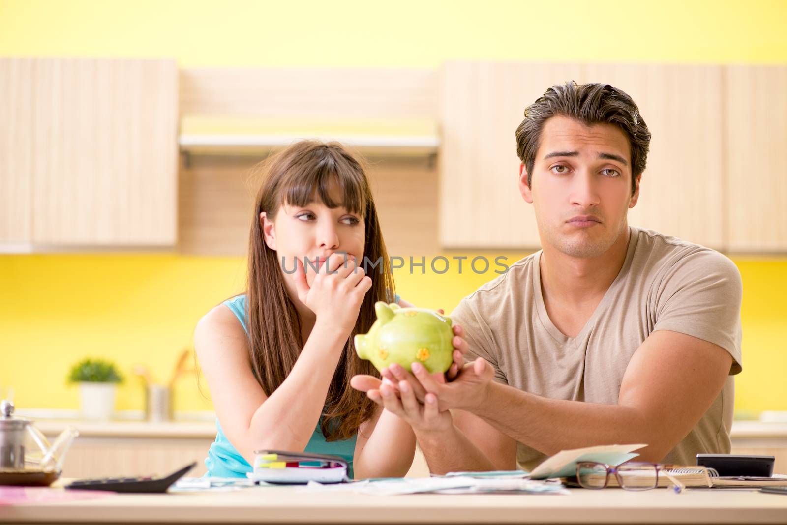 Young family struggling with personal finance by Elnur