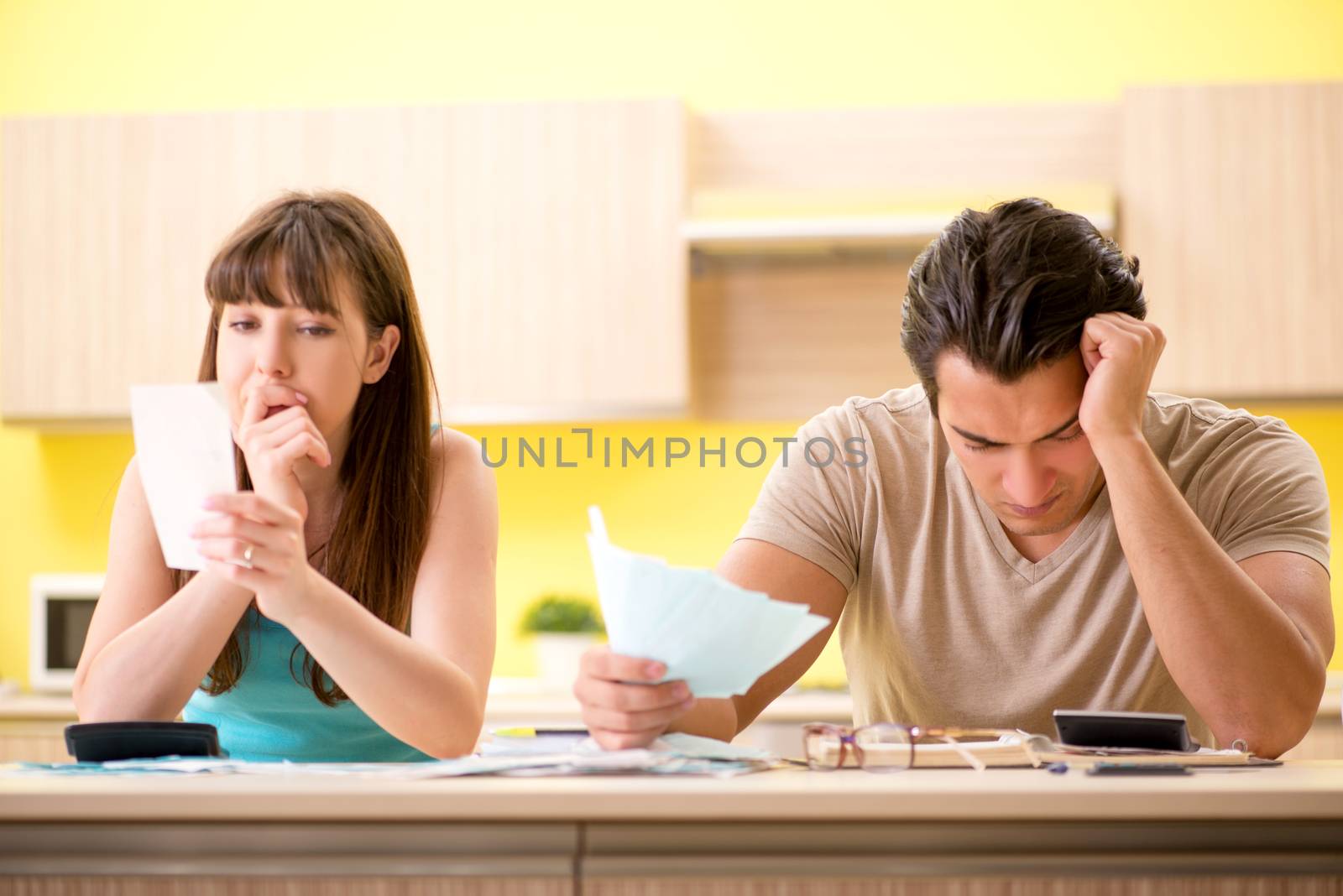 Young family struggling with personal finance by Elnur