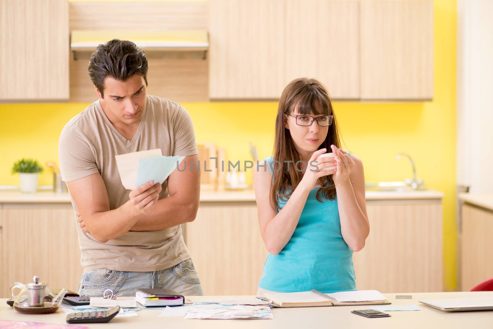 Young family struggling with personal finance by Elnur