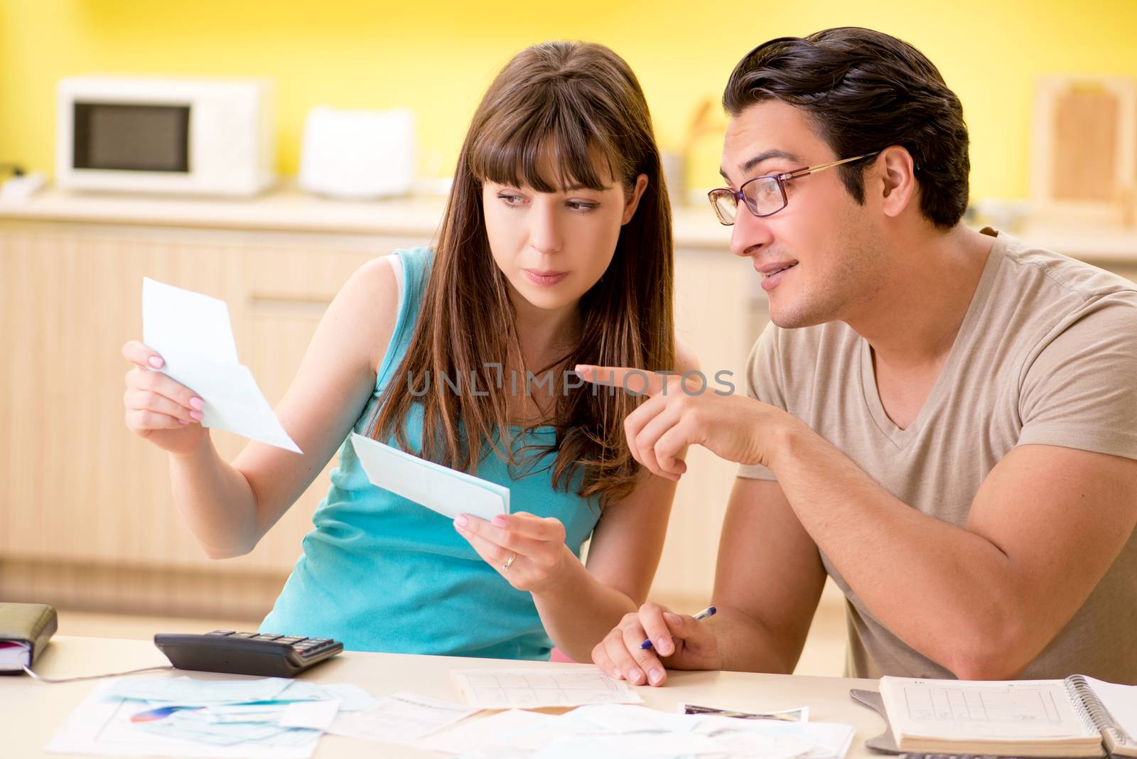 Young family struggling with personal finance by Elnur