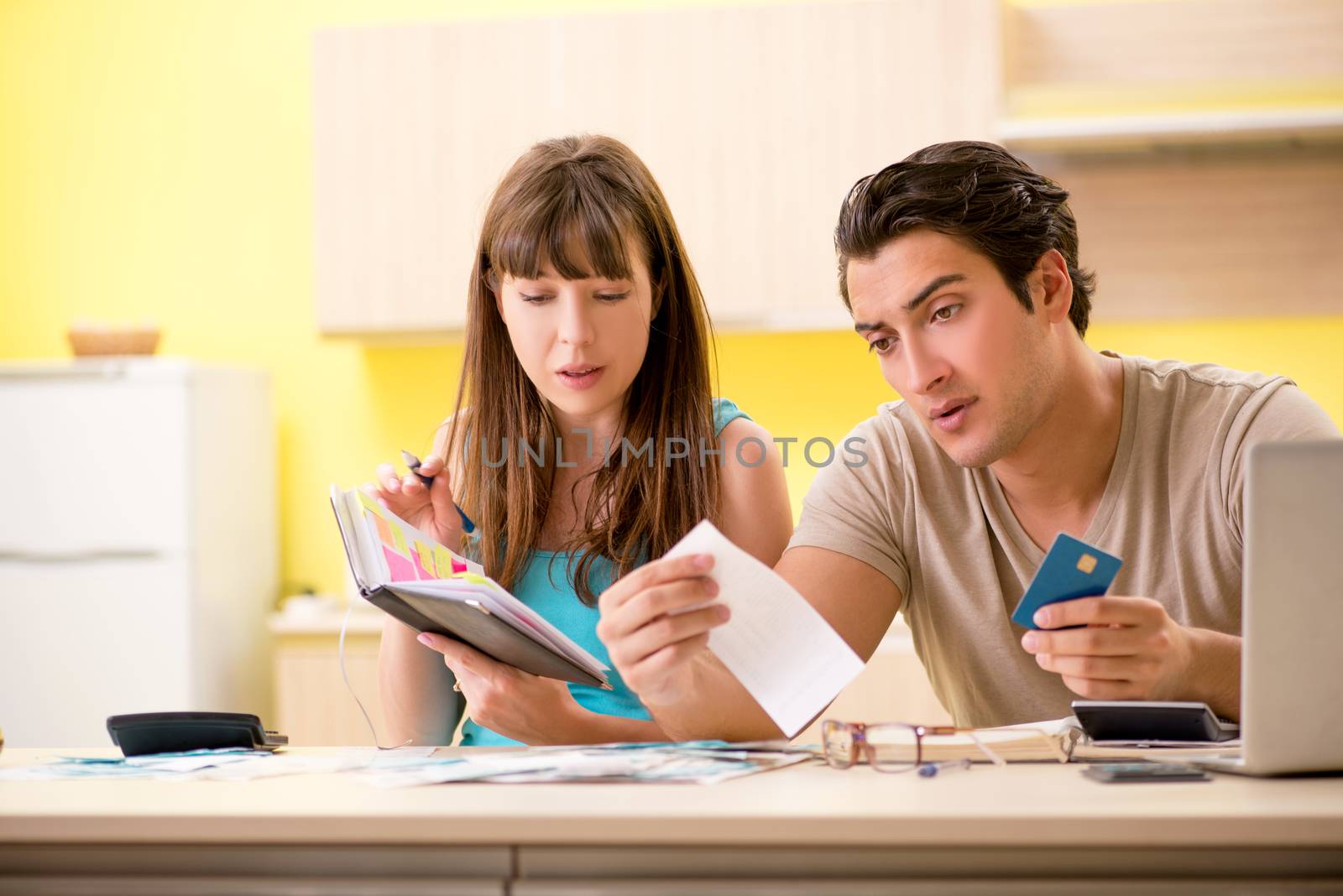 Young family struggling with personal finance by Elnur