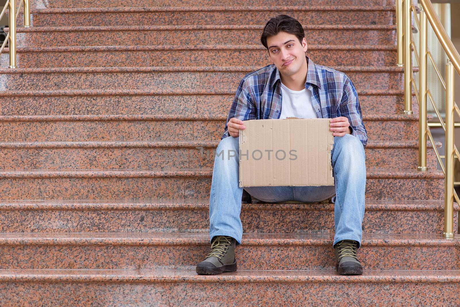 Young man begging money on the street