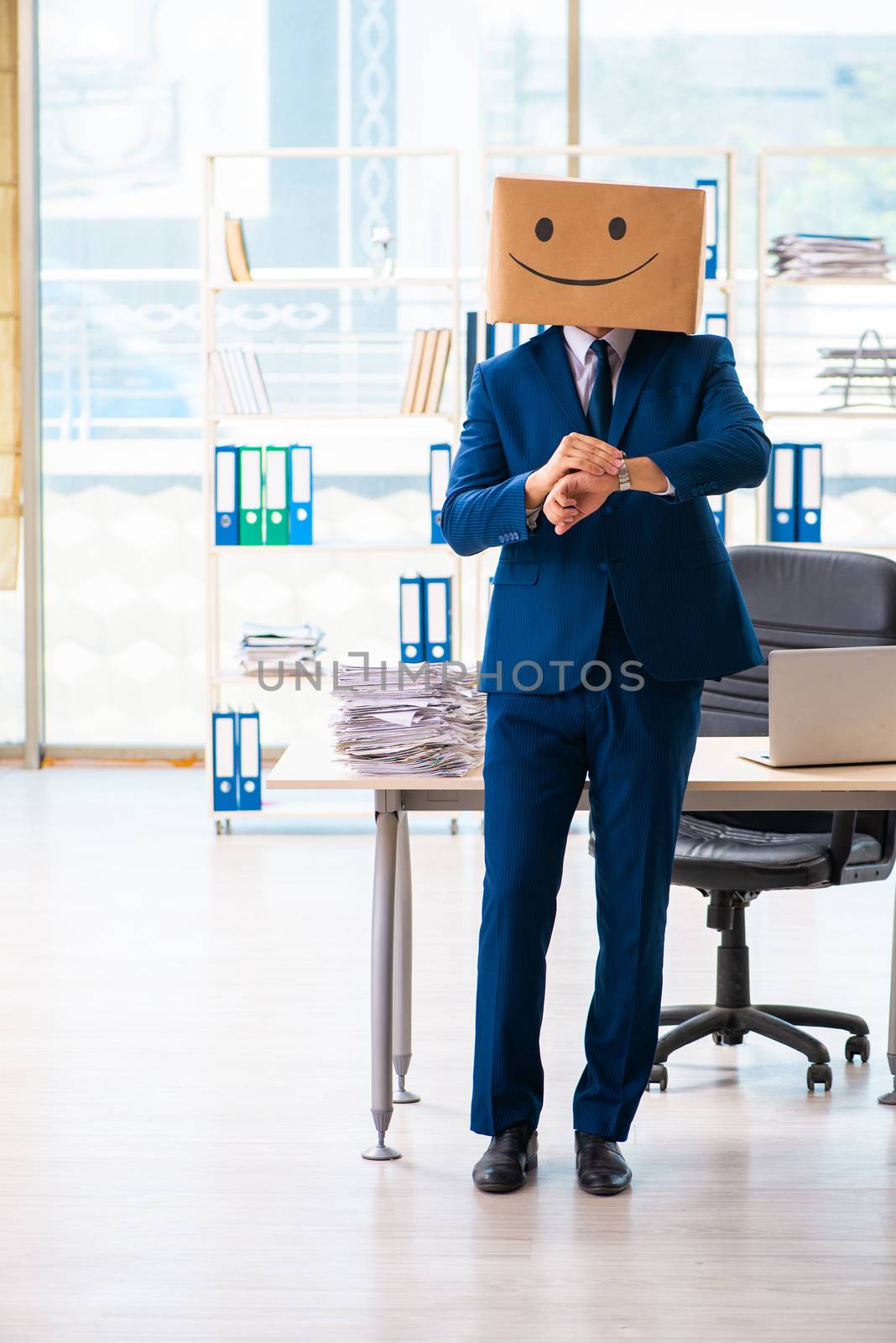 Happy man with box instead of his head