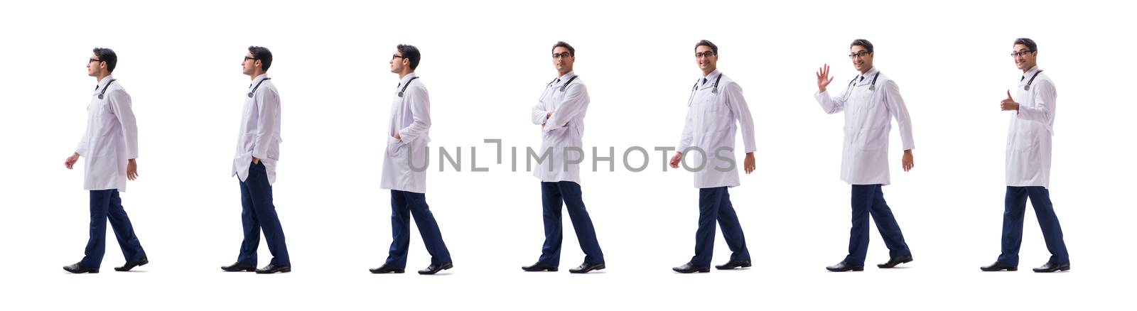 Young doctor physician standing walking isolated on white backgr by Elnur