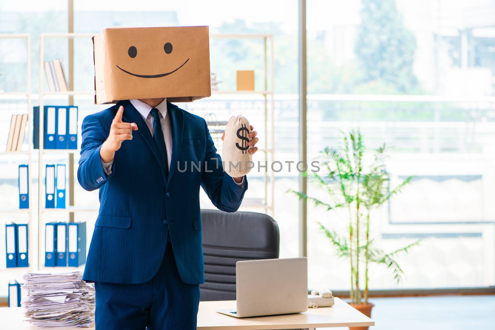 Happy man with box instead of his head