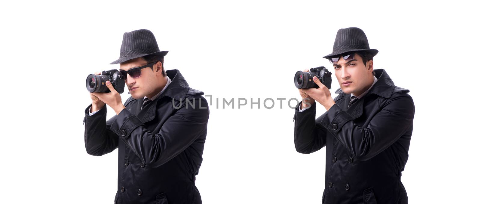 Spy with camera taking pictures isolated on white by Elnur