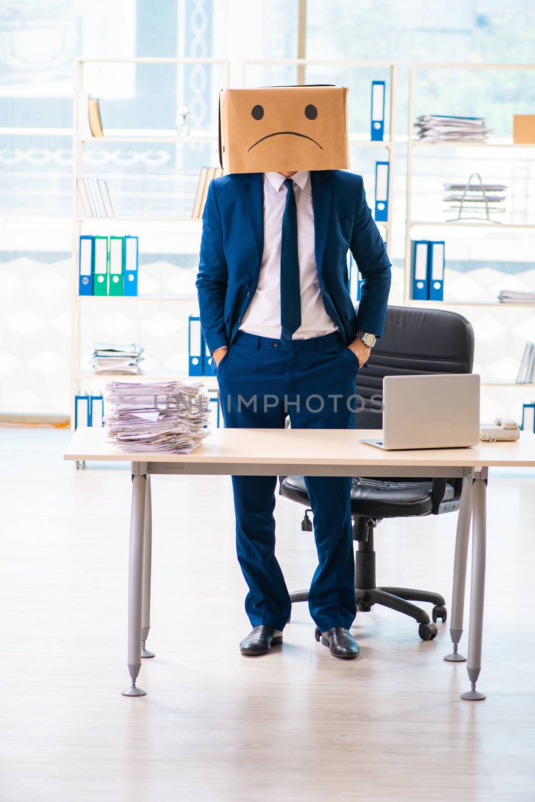 Unhappy man with box instead of his head  by Elnur
