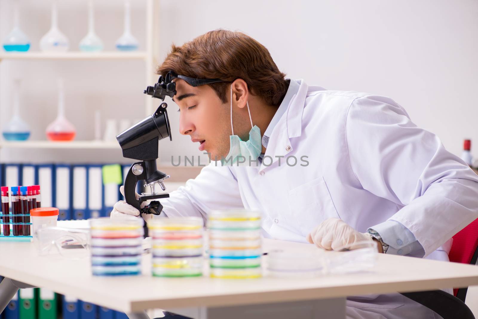 Young chemist working in the lab 