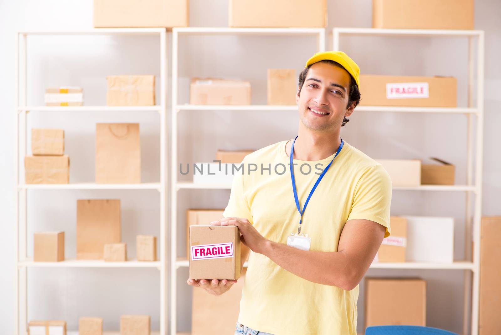 Handsome contractor working in box delivery relocation service 