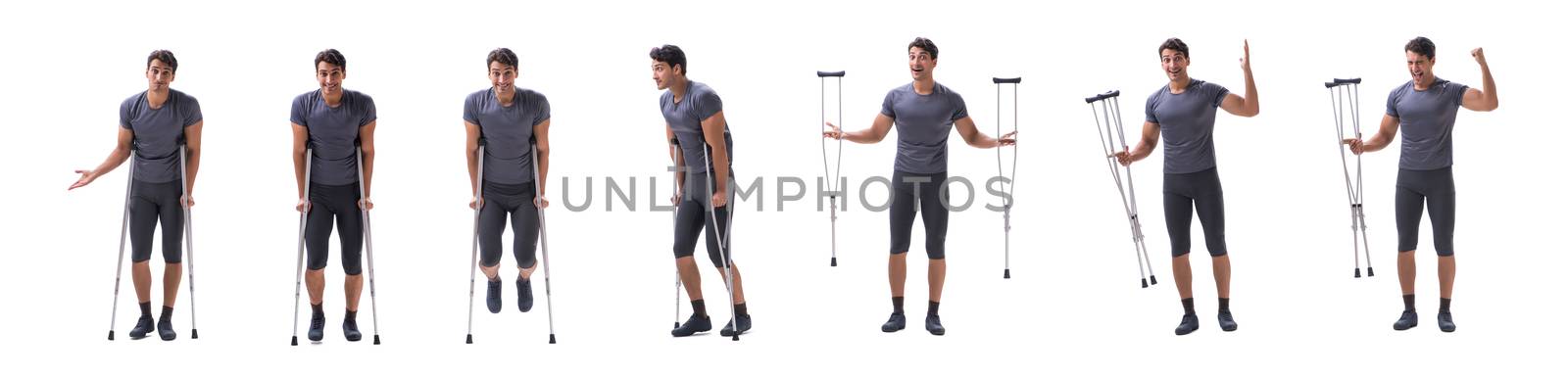 Young patient athlete sportsman suffering an injury trauma with crutches isolated on white