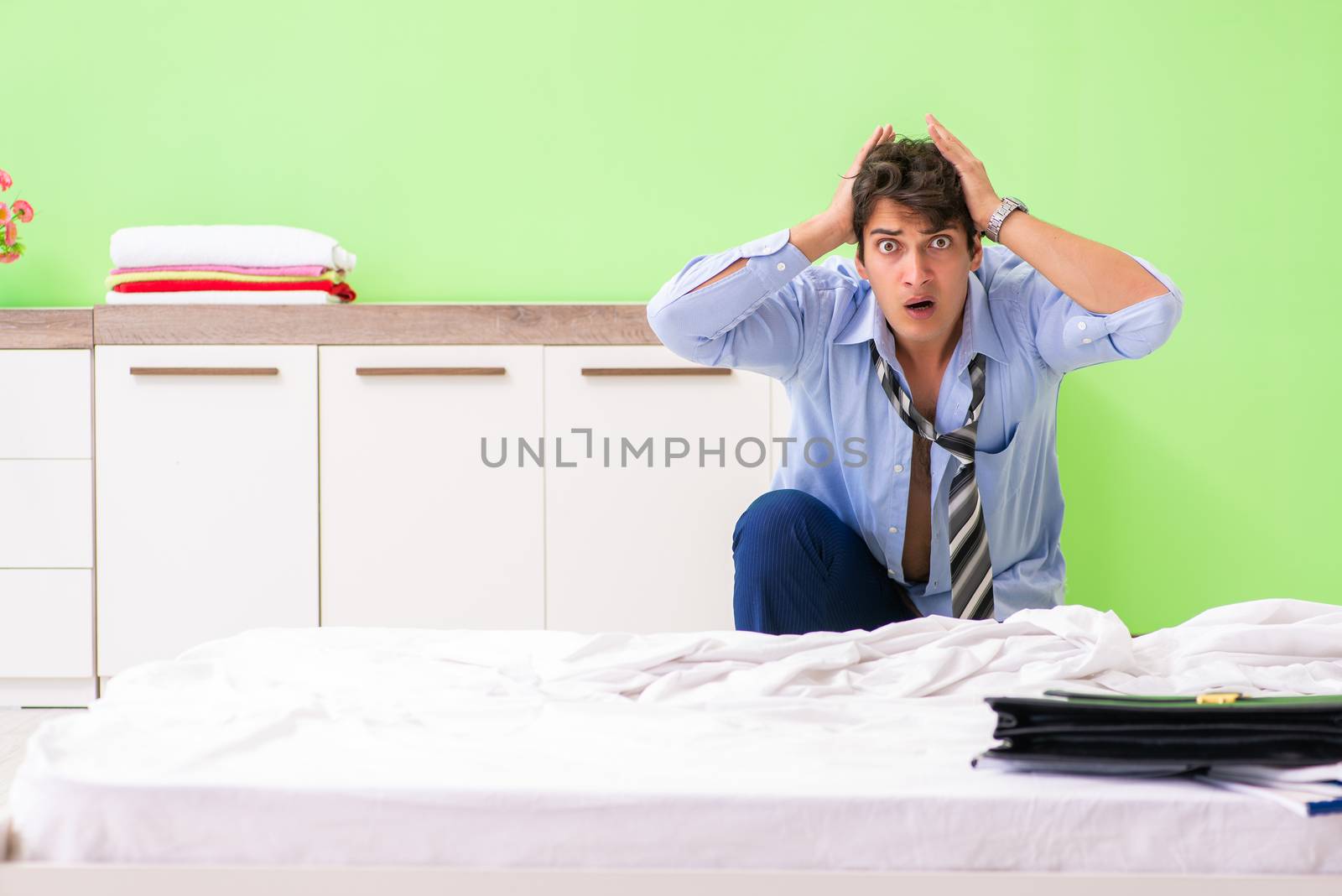 Young businessman employee late for office