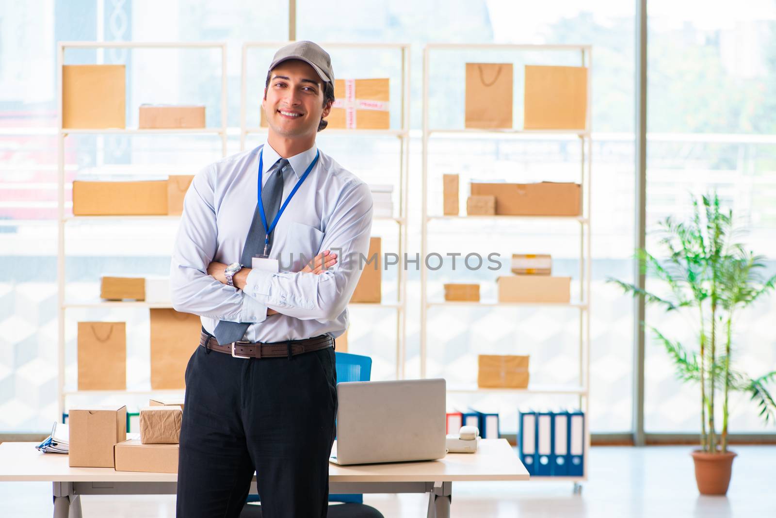 Male employee working in box delivery relocation service