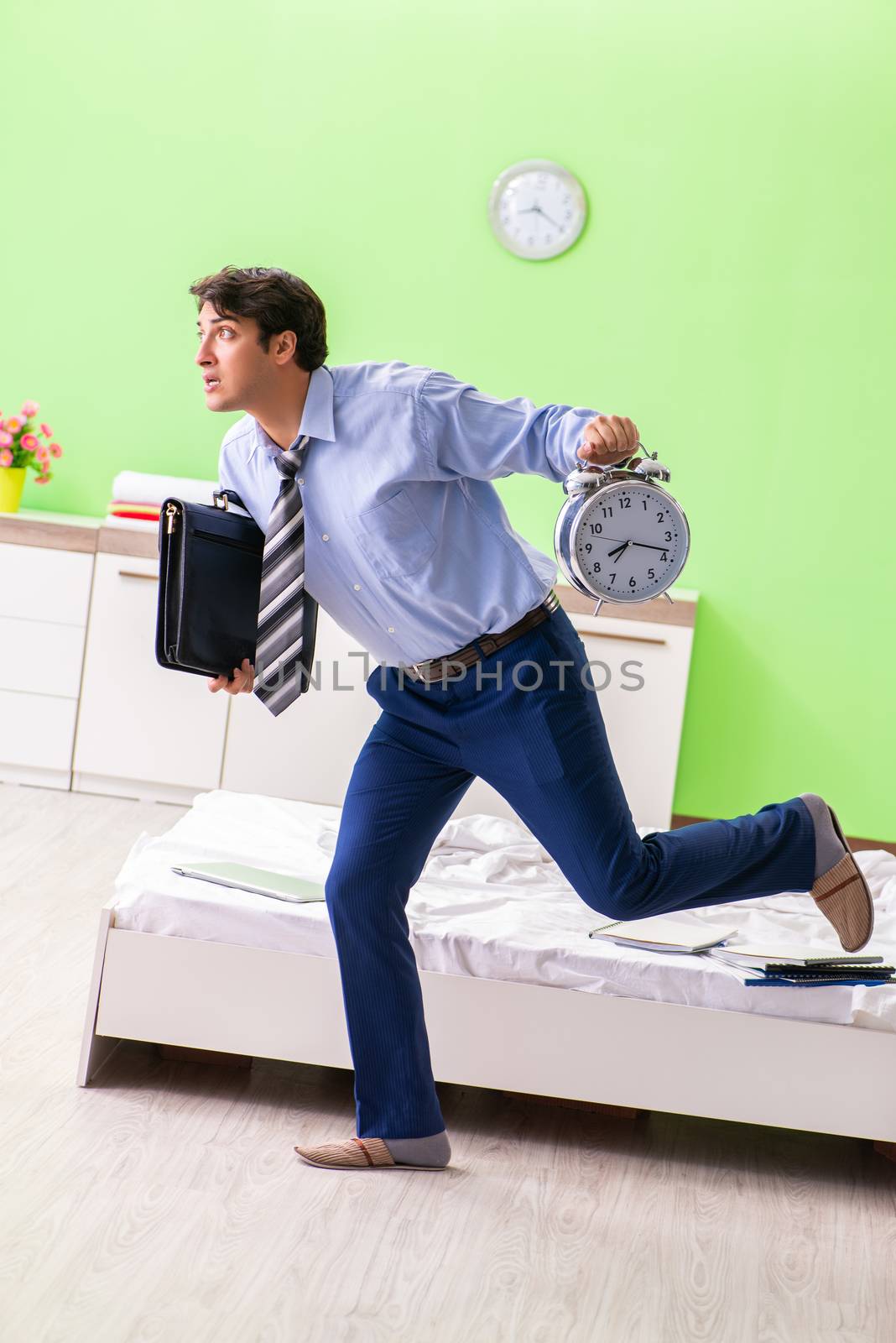 Young businessman employee late for office