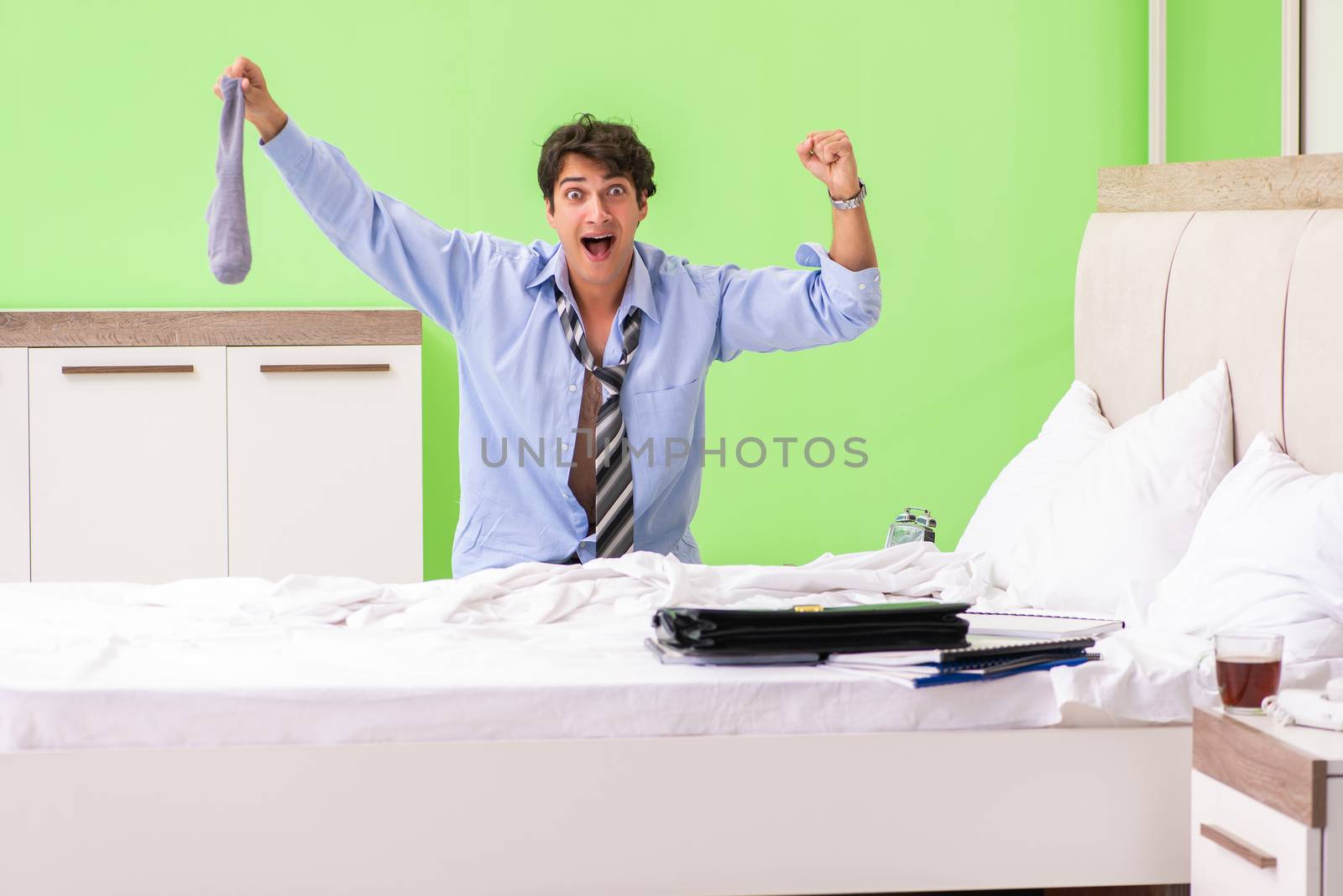 Young businessman employee late for office