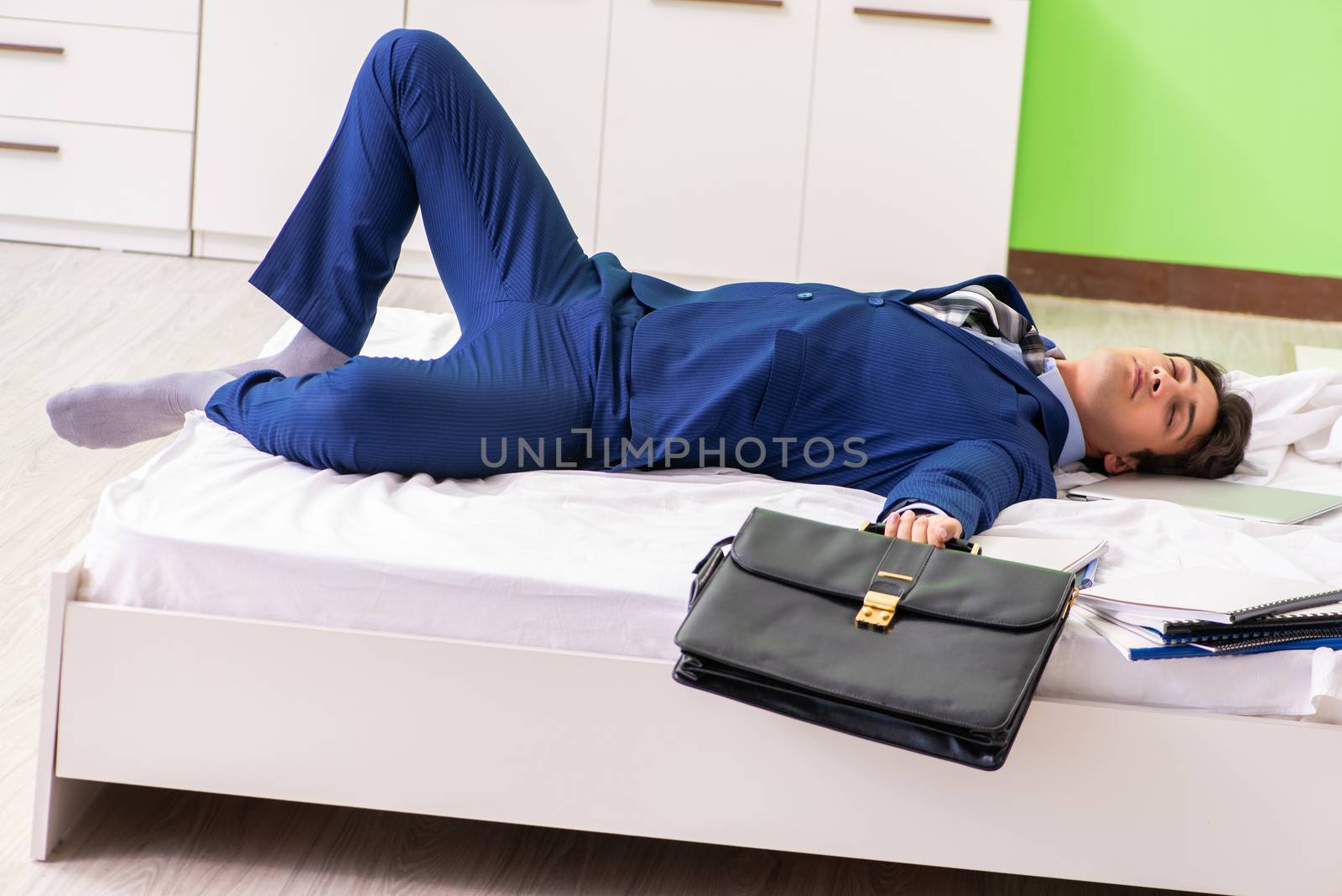 Businessman working overtime in hotel room