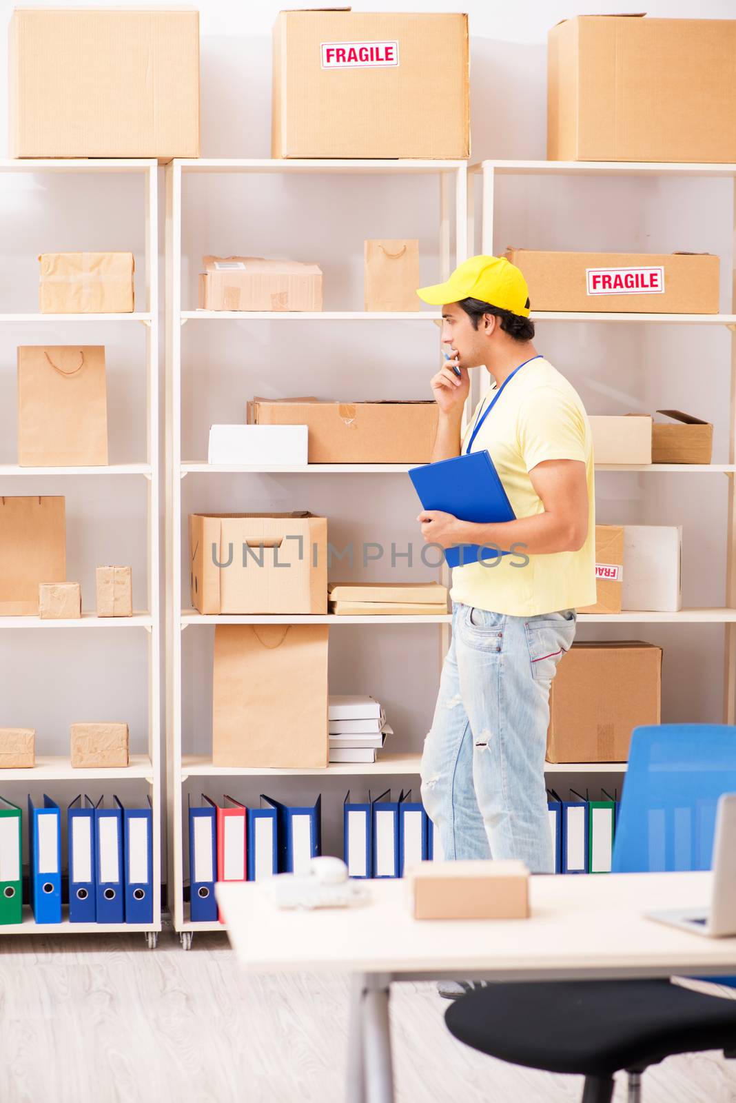 Handsome contractor working in box delivery relocation service 