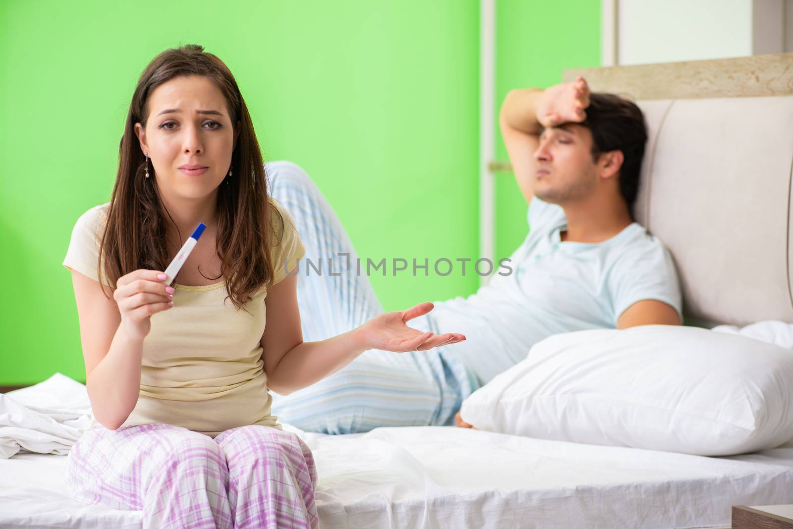 Young married woman with pregnancy results test