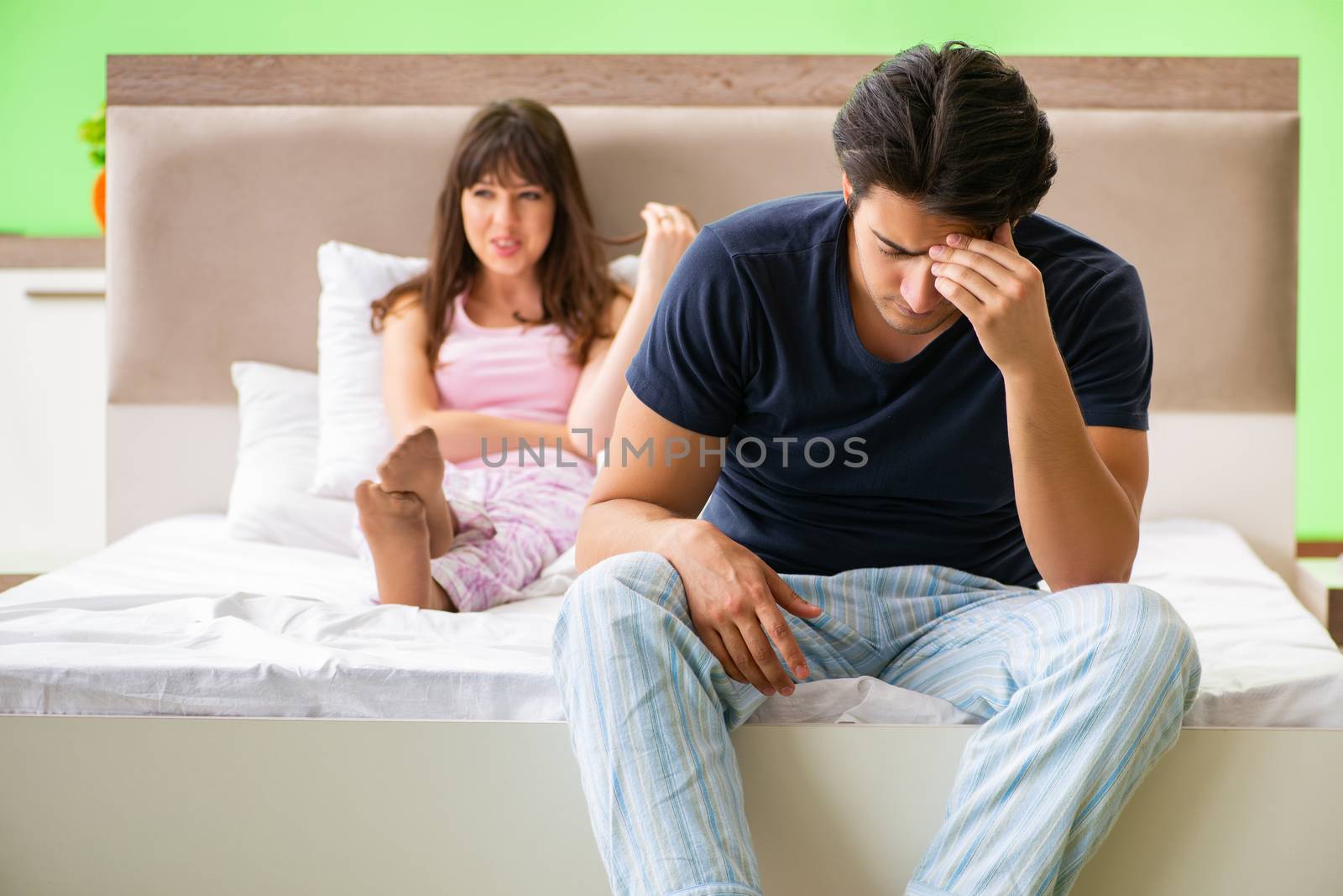 Woman and man in the bedroom after conflict