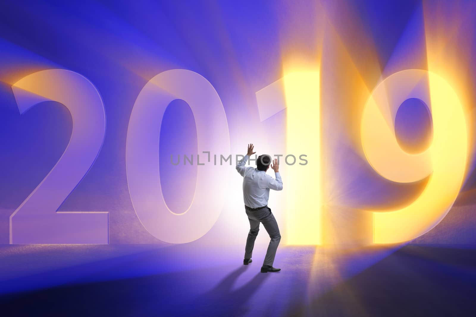 Businessman in the concept of transition to year 2019