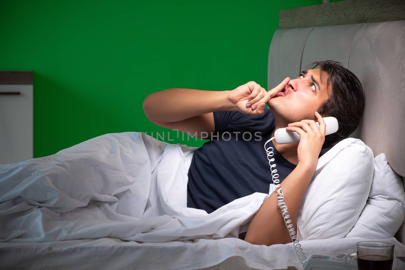 Young handsome man suffering from insomnia at home