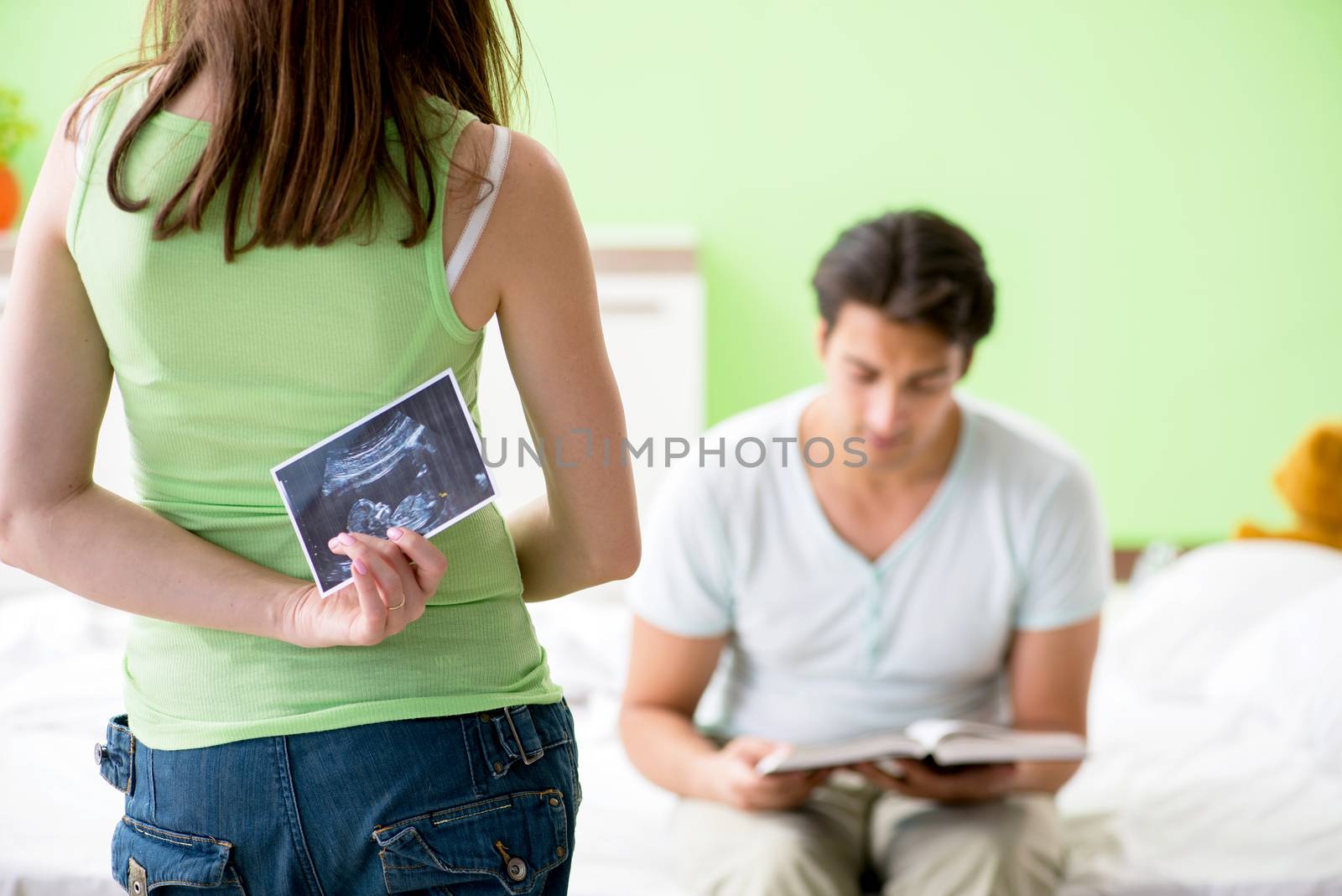 Young family finding out about pregnancy by Elnur