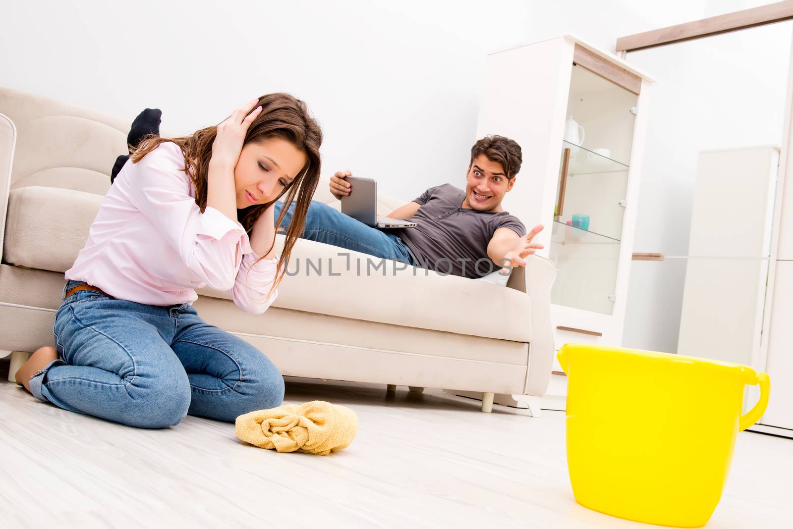 House floor cleaning concept with wife and husband
