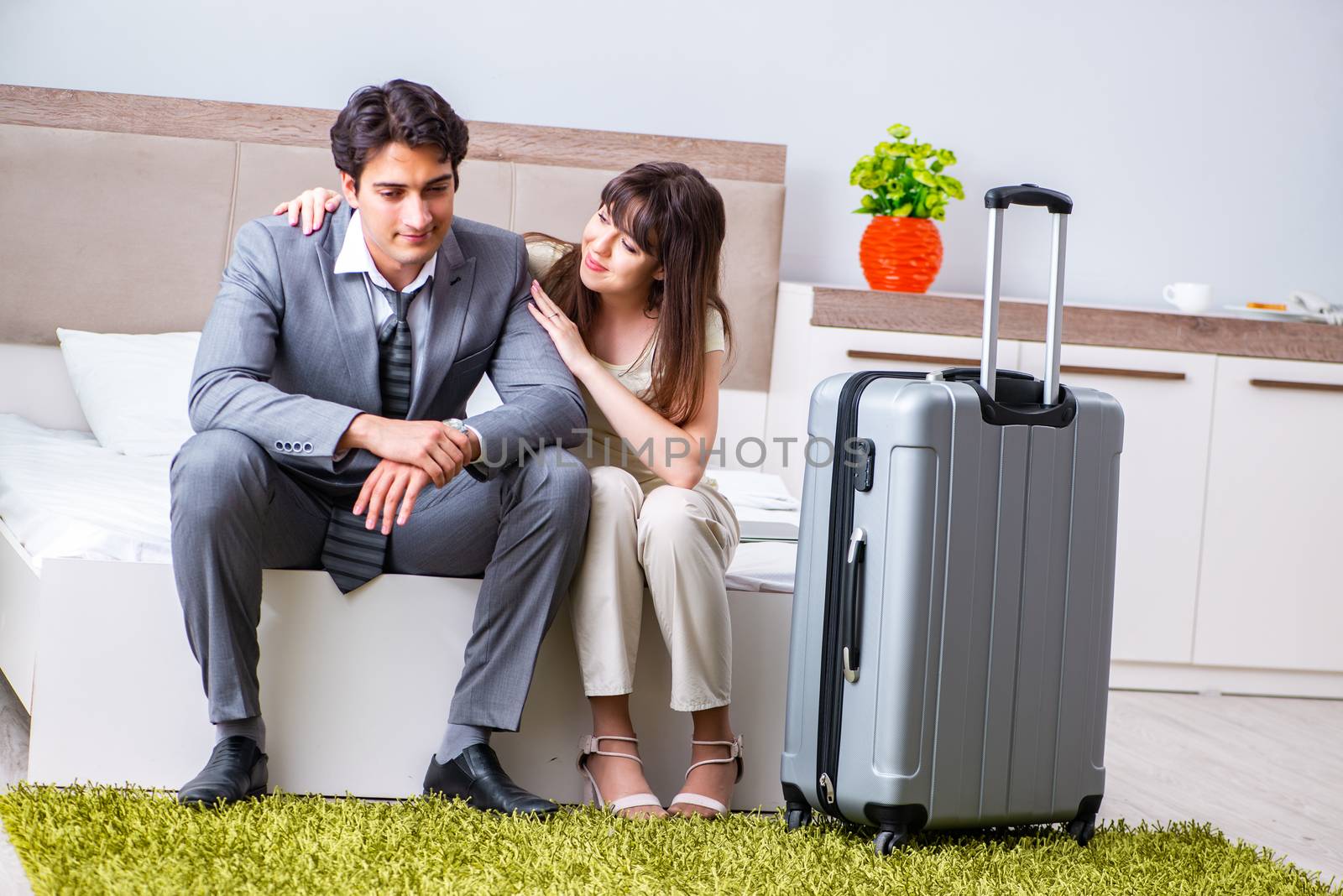 Wife seeing her husband off to business trip