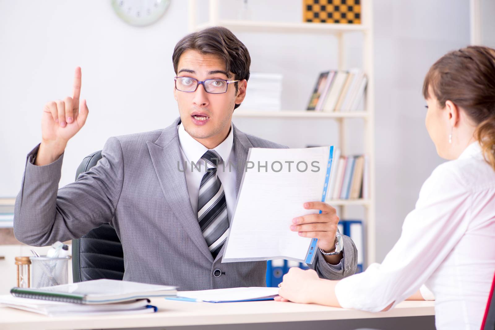 Man and woman discussing in office