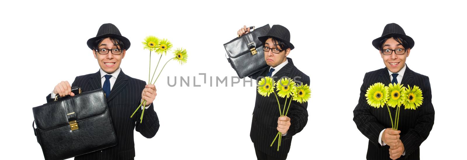 Young man in black costume with flower isolated on white by Elnur