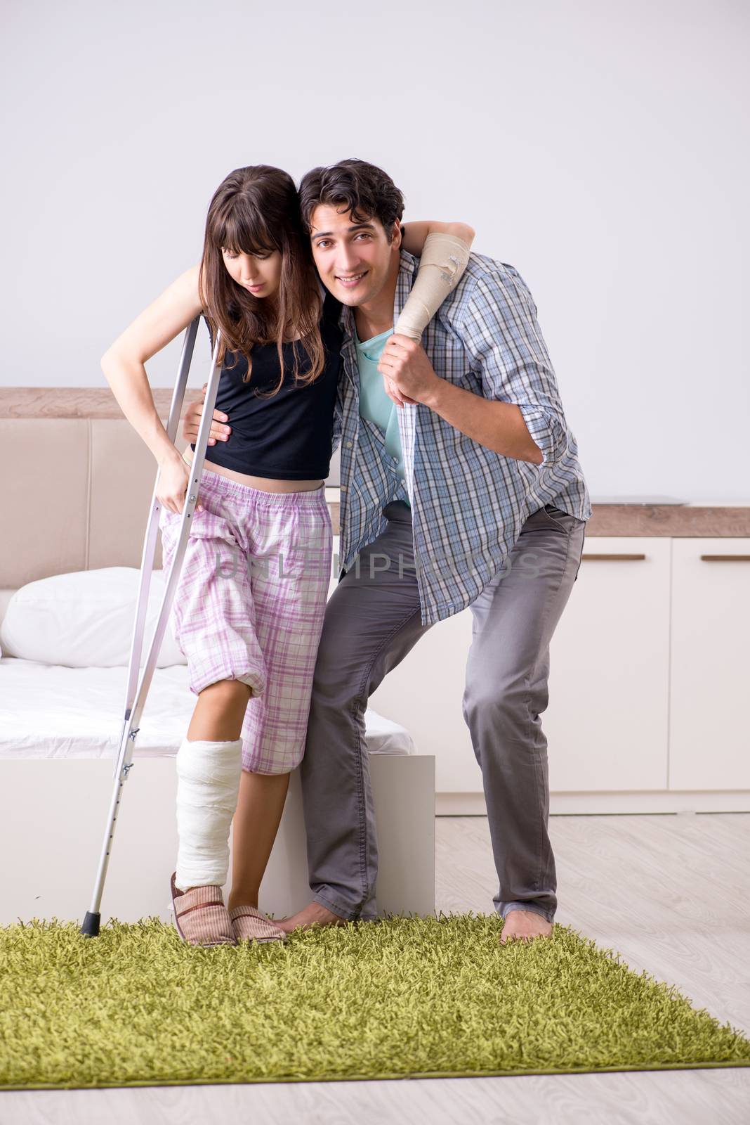 Caring husband looking after his injured wife by Elnur