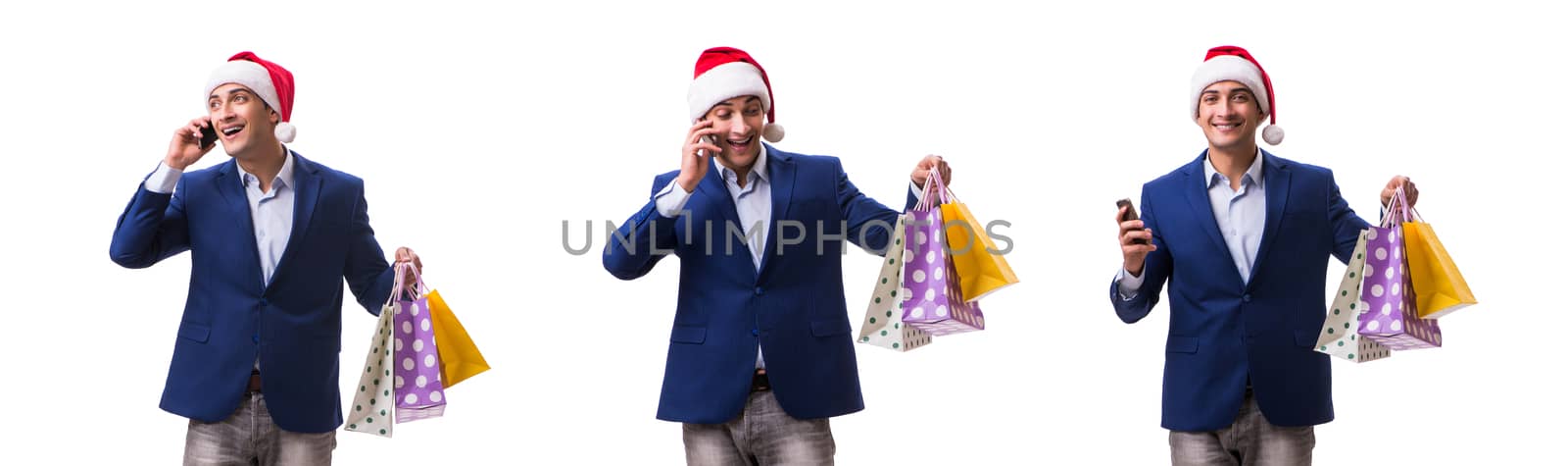 Young man with bags after christmas shopping on white background by Elnur