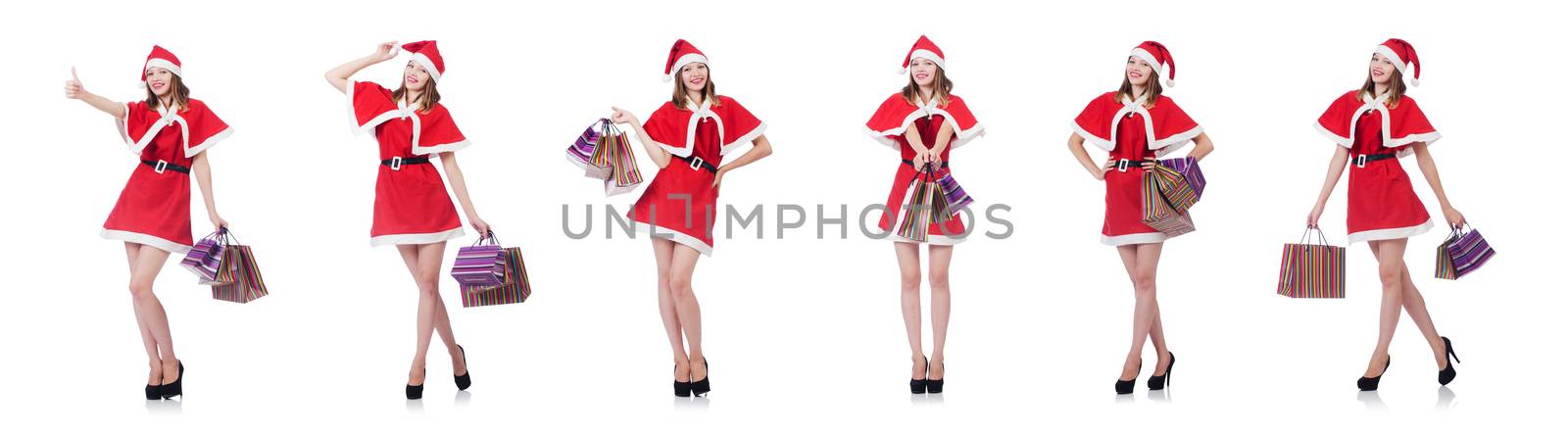 Young woman in red santa costume on white by Elnur