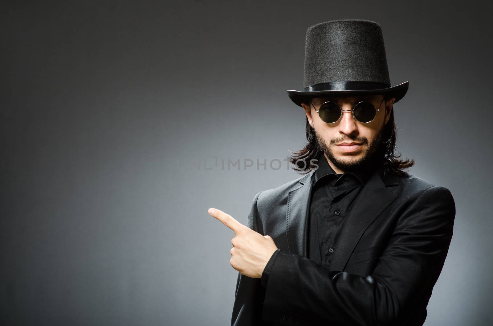 Vintage concept with man wearing black top hat