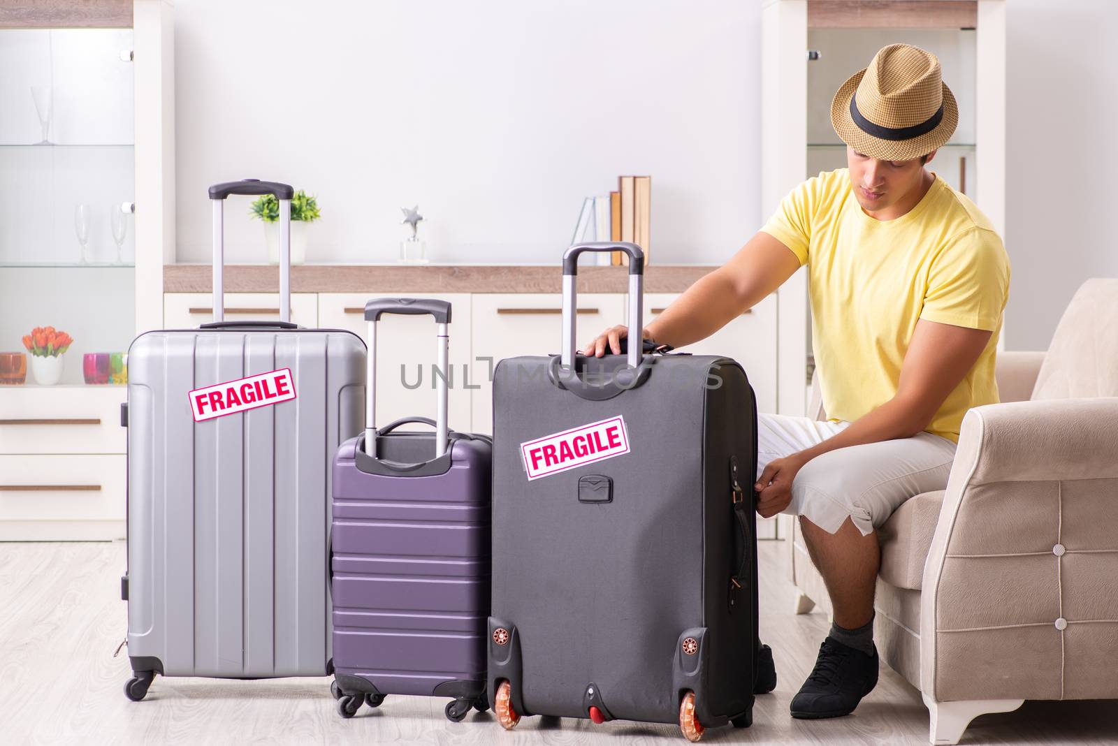 Man going on vacation with fragile suitcases