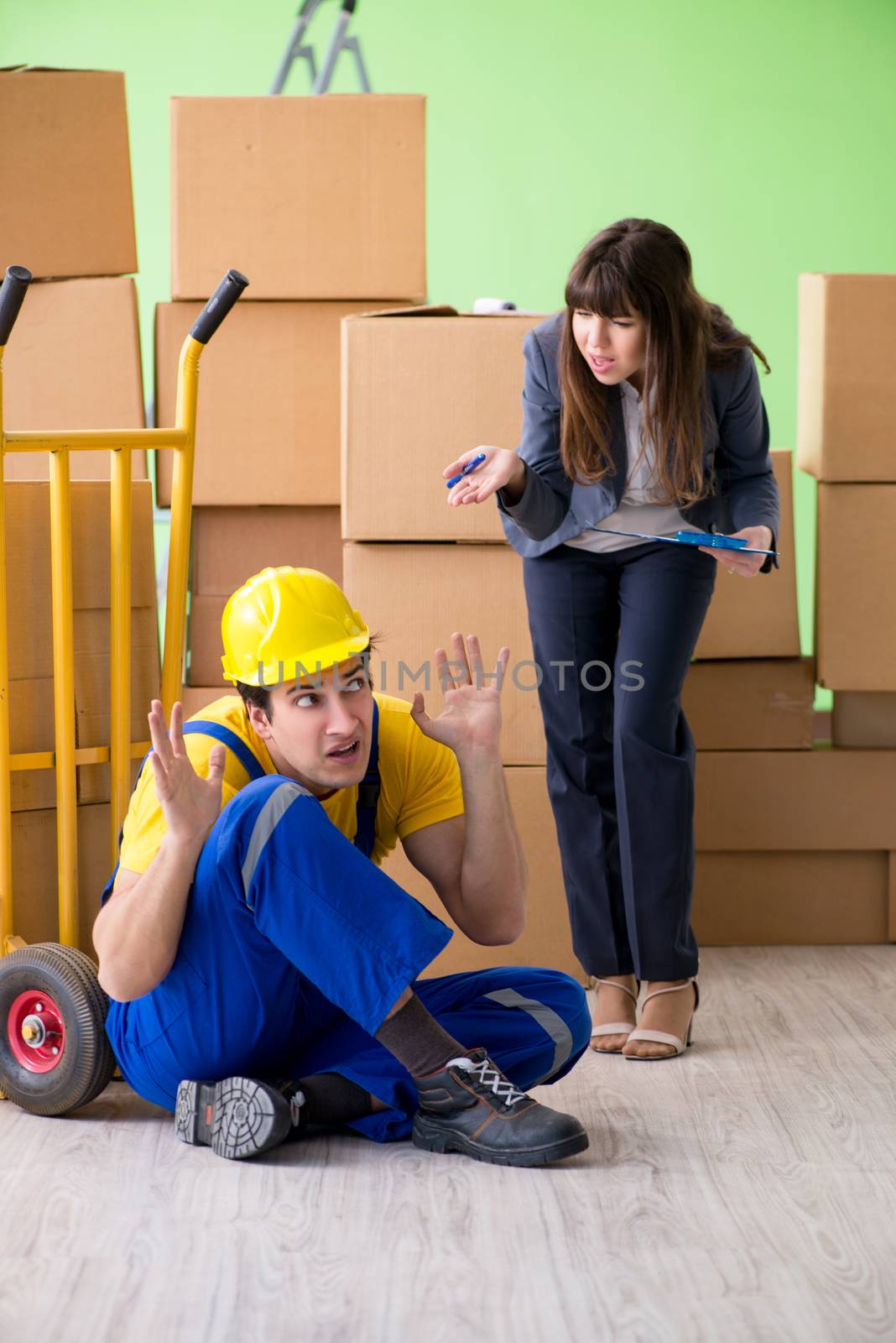 Woman boss and man contractor working with boxes delivery by Elnur
