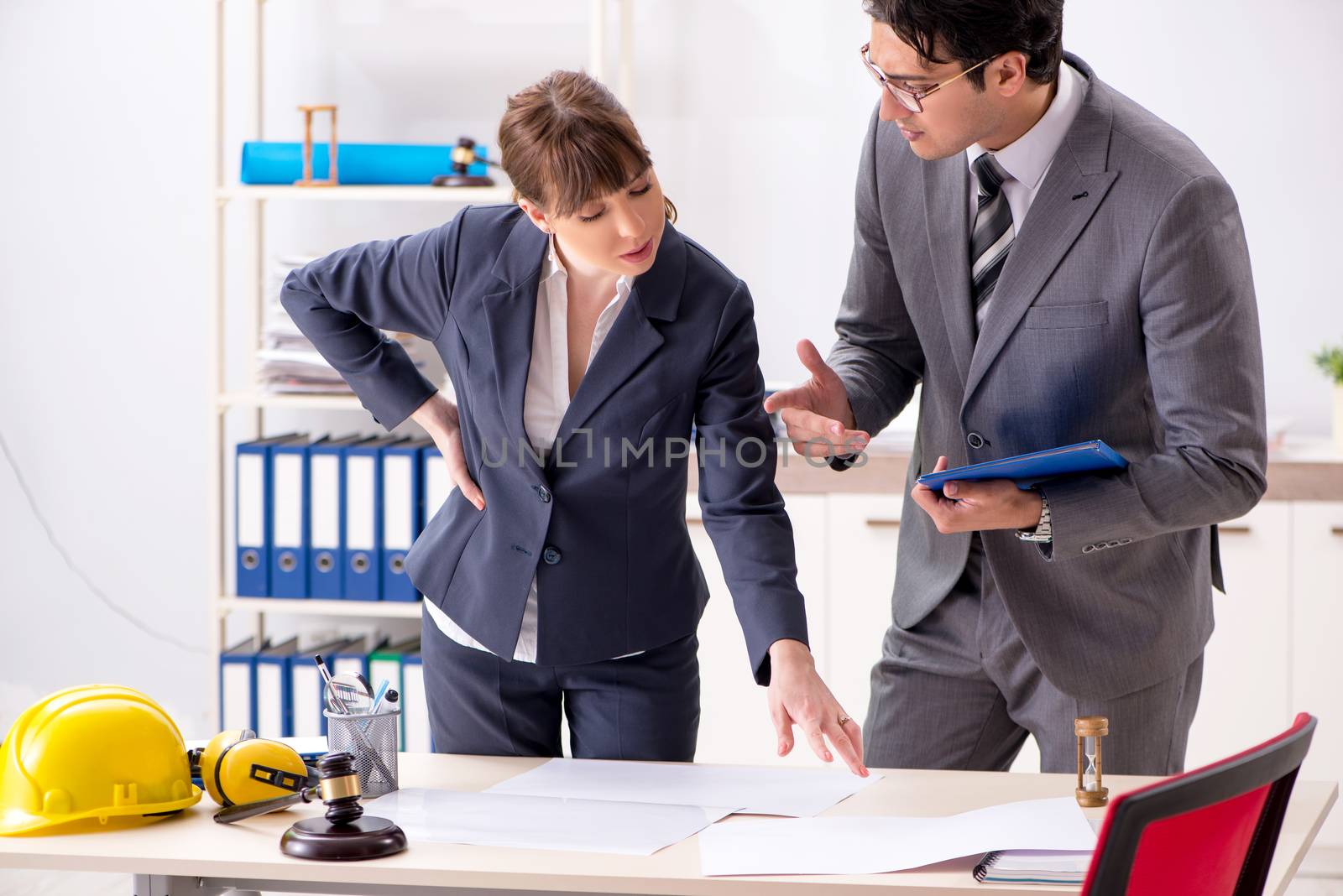 Man and woman discussing construction project