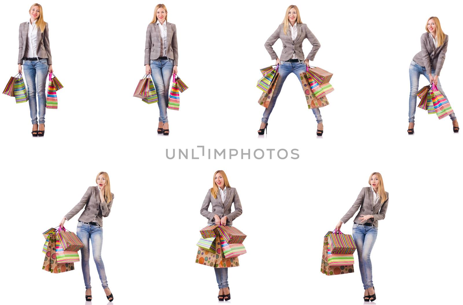 Beautiful woman with shopping bags isolated on white by Elnur