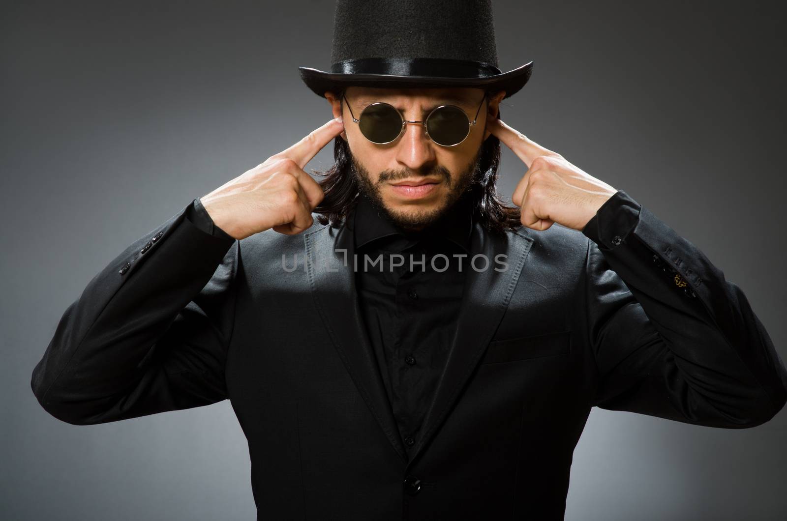 Vintage concept with man wearing black top hat