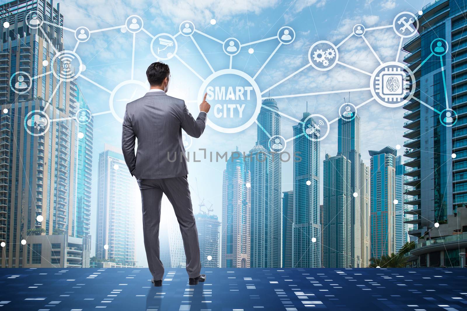 Concept of smart city with businessman pressing buttons by Elnur