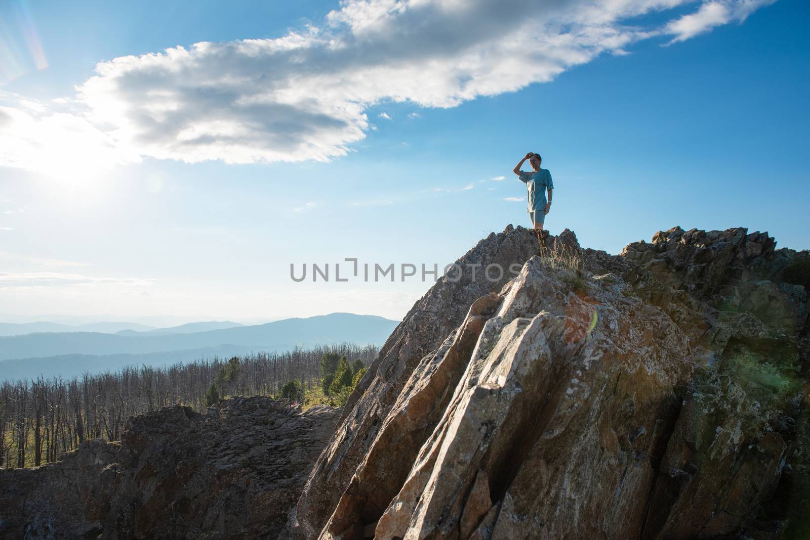 Domestic tourism, travel, lesure and freedom concept after pandemic- woman on the top of Altai mountain, beauty summer evening landcape